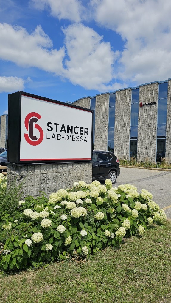 Exterior and entrance sign of Stancer Testing-Lab in Laval, Quebec